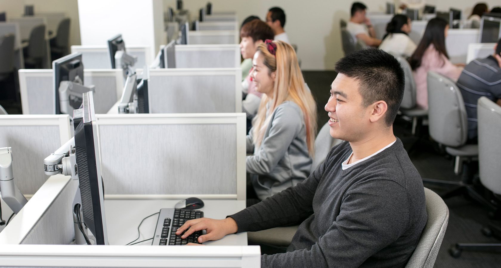 picture of a group of people taking the computer-delivered IELTS test